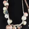 krista larson collier giant celestial necklace en coloris white peony chez abby maud de face en details